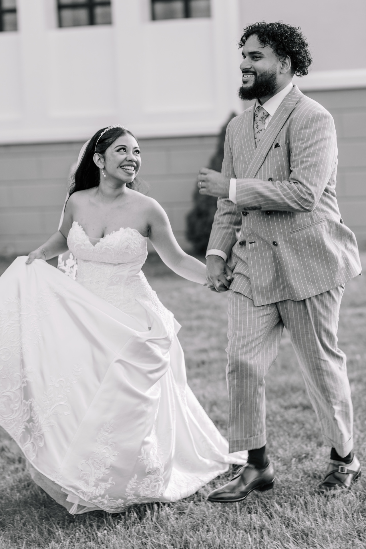 Bride and groom walking, black and white